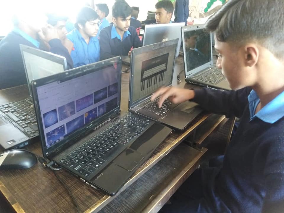Volunteers teaching students